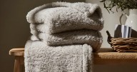 Dunelm buyers can get a 'cosy' teddy fleece throw for £3 with little