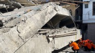 Indonesian rescue workers 'racing against time' in search for dozens in rubble of collapsed school
