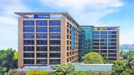 YES Bank shares hit 1-yr high; stock zooms 40% in 6 months; what should investors do?