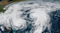 Bermuda lashed by distant hurricane and prepares for the stronger Imelda