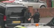 Police 'arrest two men' yards away from Manchester synagogue attack with street shut off