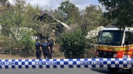 Woman charged with three counts of murder and arson over fatal fire in Gladstone, Queensland