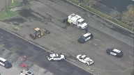 Police investigating reported death near asphalt work area at Sante Fe Springs shopping center