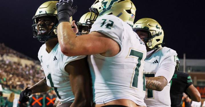 No. 24 South Florida scores 4 TDs in a 4 1/2-minute span and hands North Texas its 1st loss
