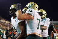 No. 24 South Florida scores 4 TDs in a 3 1/2-minute span and hands North Texas its 1st loss