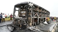 At least 25 killed as bus bursts into flames after crash with motorbike in India