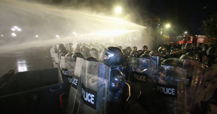 Georgia's police use water cannons to push back protesters
