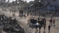 Some Palestinians pack up and move north toward their homes in Gaza after ceasefire goes into effect