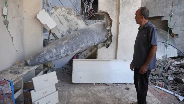 Gaza family forced to live around undetonated bomb lodged in their home
