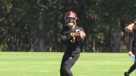 Jayden Daniels, wearing a knee brace, practices fully for the first time in weeks