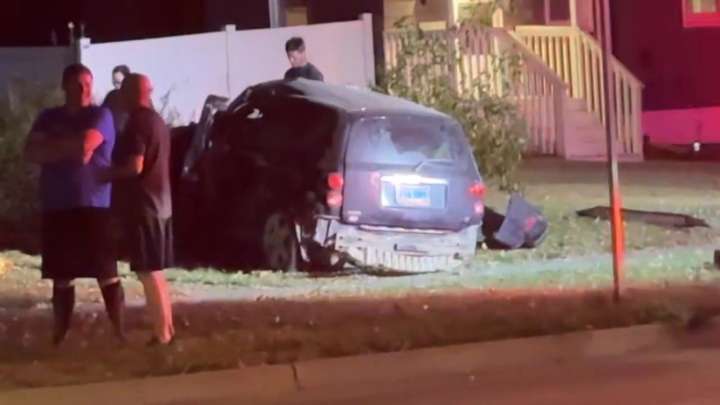 Police take 1 into custody after car crashes into north Fargo yard