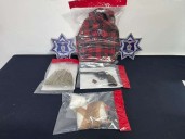 Detienen a hombre con droga y arma de fuego en la Granjas de Santa Elena