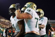 No. 24 South Florida scores 4 TDs in a 4 1/2-minute span and hands North Texas its 1st loss