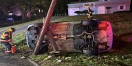 Driver rescued from overturned car after striking pole in North Haven