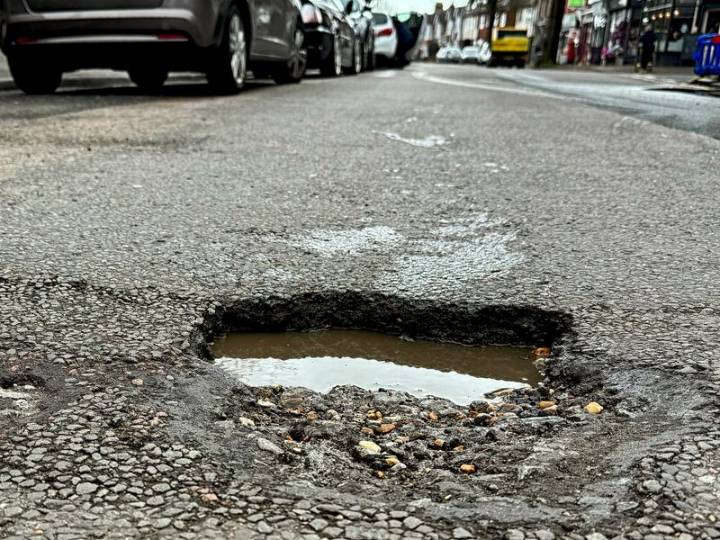 Woman banker killed after falling off bike, run over by truck on pothole