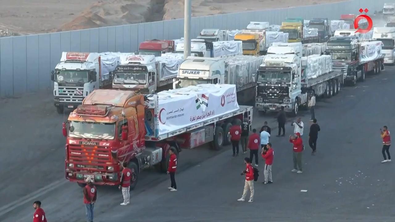 Convoy of trucks carrying aid for Gaza at Rafah crossing in Egypt, heading for Israeli inspection