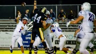 See Cade Young throw four touchdowns in West Henderson…