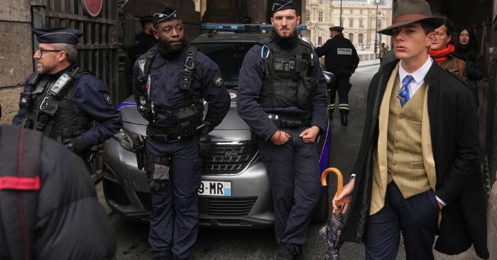 Inspector Clouseau? The mystery man in an AP photo after the Louvre jewel heist creates a buzz