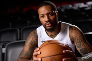 Not currently playing and not a coach, Damian Lillard has a unique role with the Blazers