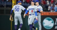 Dodgers hold off Phillies' rally; Brewers slug their way to a 2