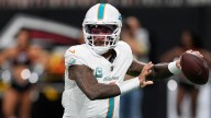 Dolphins' Tua Tagovailoa battles illness to throw 4 TDs vs Falcons