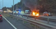 Firefighters battle car blaze on busy Cambridgeshire road