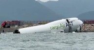Two killed after cargo plane skids off runway into sea at Hong Kong airport