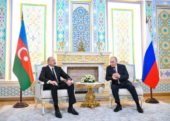 Azerbaijan releases Russian journalist to house arrest after Putin