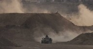 Israel delays aid after slow Hamas return of bodies