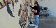 Mural in Auburn adds to artist’s goal of painting 50,000 honeybees