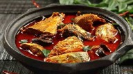 Husband pours boiling fish curry on wife for not wearing sacred talisman given by ustad