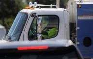 DPW employee injured after falling off sanitation truck