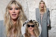 Heidi Klum wears totally see-through lace dress with platinum grill at Vetements during Paris Fashion Week