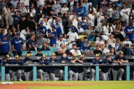 Shohei Ohtani hits 3 homers and strikes out 10 in Dodgers' clinching 5