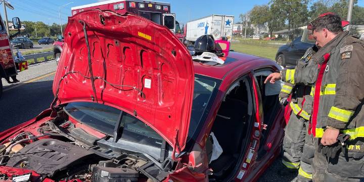 Driver trapped in car after a collision on I