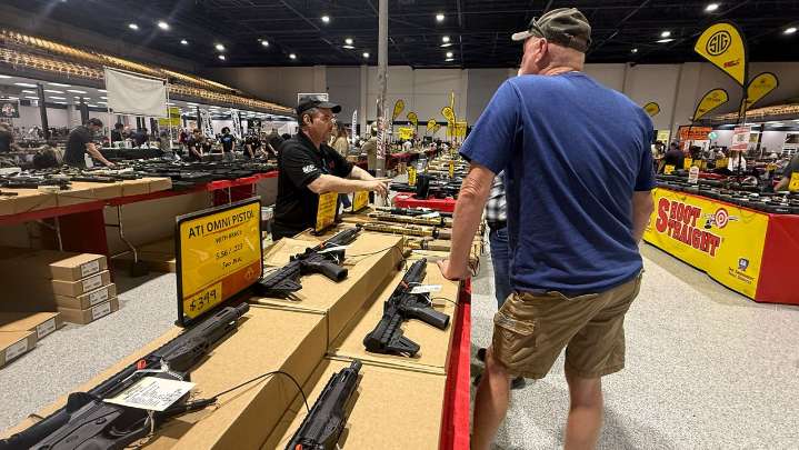 Tax exemption, open carry law drive many to Tampa gun show