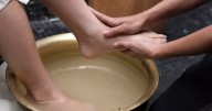 Madhya Pradesh Man made to wash Brahmin's feet, drink the water over AI image