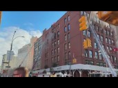 SoHo apartment fire injures 2 firefighters