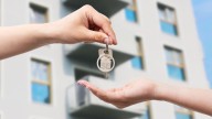 Can capital gains from the sale of two house floors be combined to purchase a single residential property for claiming LTCG benefits u/s 54?