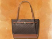 Michael Kors outlet deal 2025: Reed Signature Logo Tote drops to $119