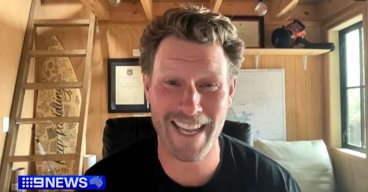 Scientist's shark tag washes up on Gold Coast beach