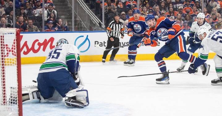 Oilers net first win with 3-1 decision over resilient Canucks