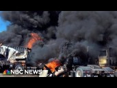 Two killed when small plane crashes into parked tractor