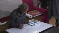 North Portland man brings joy with daily whiteboard art outside his home