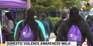 Walkers stand with survivors of domestic violence at 5th annual rally