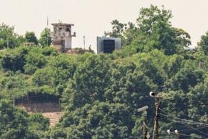 North Korean soldier held by Seoul after crossing land border
