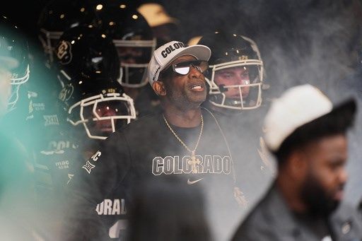 Colorado fans storm field after win over No. 22 Iowa State, Deion Sanders loves it but fine may loom