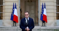 France's re-appointed prime minister calls for calm