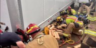 Sparks firefighters save person trapped under truck trailer