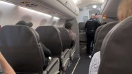 Panicked American Airlines pilots make emergency landing after they hear mystery banging on cockpit door
